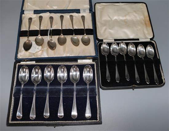 Three cased sets of six silver tea or coffee spoons.